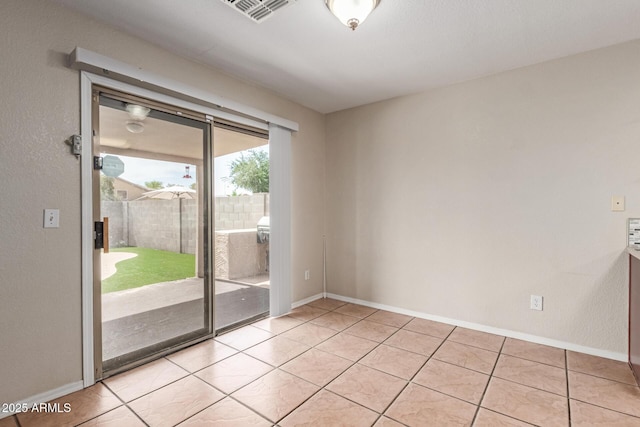 681 W Racine Loop, Casa Grande, AZ 85122 - empty room featuring baseboards and light tile patterned flooring