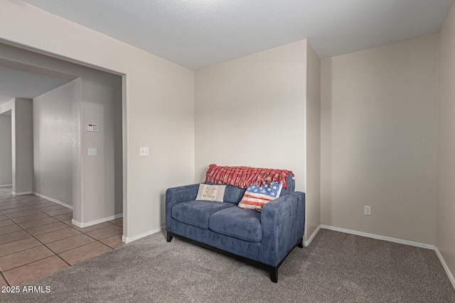 681 W Racine Loop, Casa Grande, AZ 85122 - living area with carpet, baseboards, and tile patterned floors