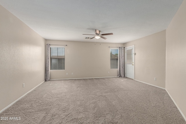 681 W Racine Loop, Casa Grande, AZ 85122 - carpeted empty room with a ceiling fan, plenty of natural light, and baseboards
