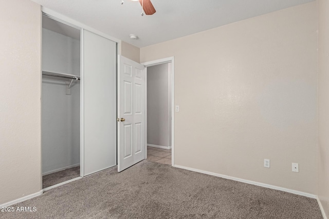 681 W Racine Loop, Casa Grande, AZ 85122 - unfurnished bedroom with carpet floors, baseboards, a closet, and ceiling fan