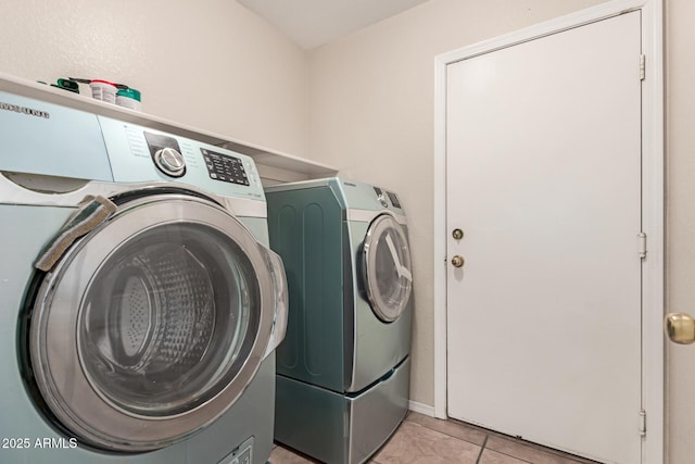 681 W Racine Loop, Casa Grande, AZ 85122 - washroom with washer and dryer and light tile patterned floors
