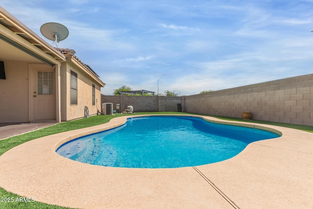 681 W Racine Loop, Casa Grande, AZ 85122 - view of swimming pool featuring central AC unit, a fenced backyard, and a patio area