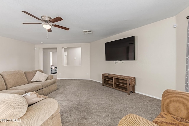 681 W Racine Loop, Casa Grande, AZ 85122 - living area with ceiling fan, carpet flooring, and baseboards