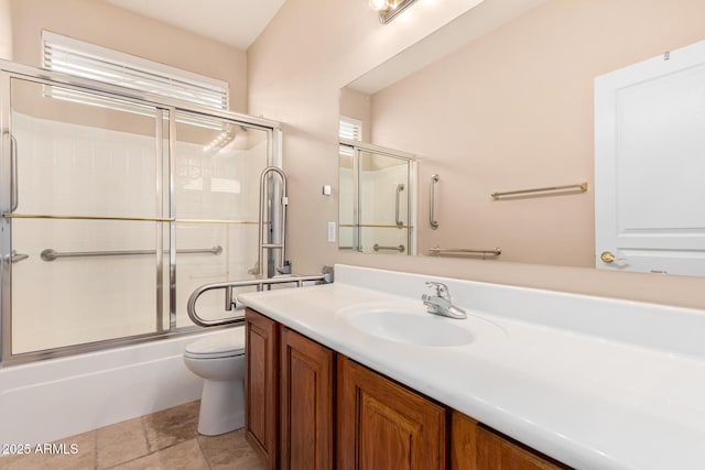 full bath featuring enclosed tub / shower combo, vanity, and toilet