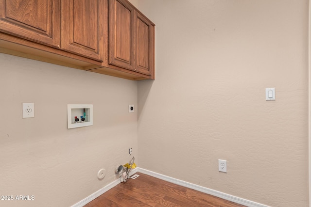 laundry room with washer hookup, hookup for a gas dryer, cabinet space, dark wood-type flooring, and hookup for an electric dryer