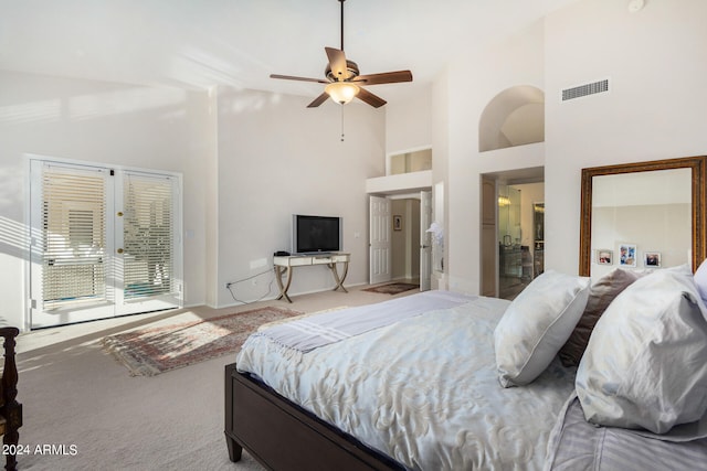 carpeted bedroom with french doors, access to outside, high vaulted ceiling, and ceiling fan