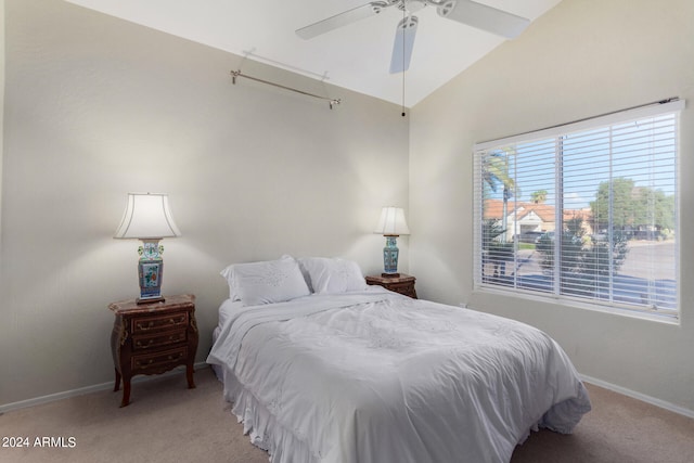 carpeted bedroom featuring lofted ceiling and ceiling fan