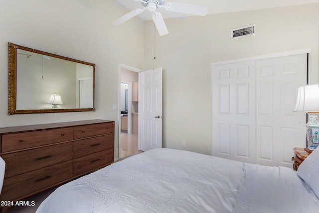 bedroom with a closet, high vaulted ceiling, and ceiling fan