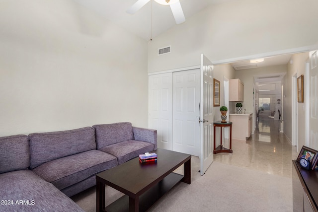 living room with high vaulted ceiling and ceiling fan