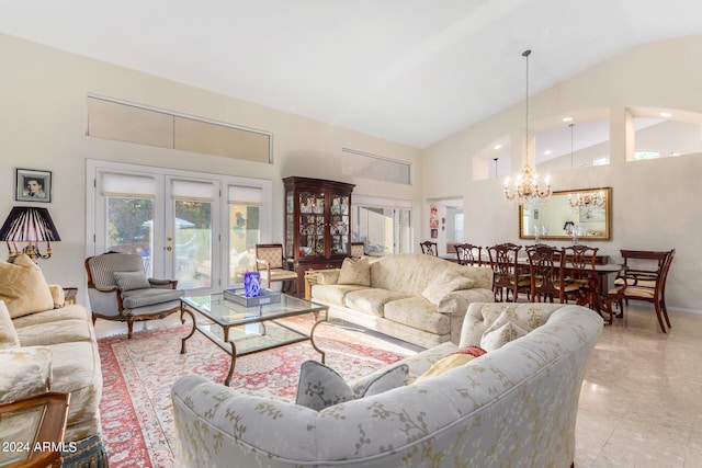 tiled living room with a chandelier and high vaulted ceiling