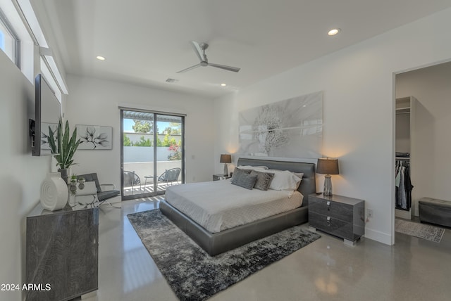 bedroom featuring concrete flooring, a walk in closet, ceiling fan, and access to exterior