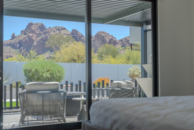 bedroom featuring a mountain view