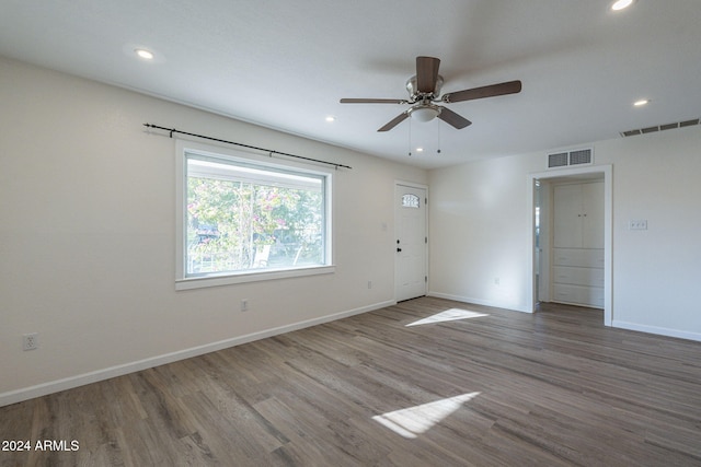 empty room featuring ceiling fan and wood-type flooring