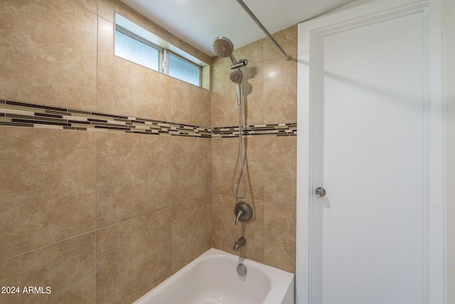 bathroom featuring tiled shower / bath combo