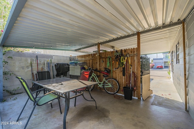view of patio featuring outdoor dining space and fence