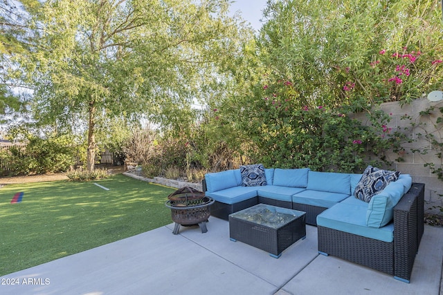 view of patio featuring an outdoor living space with a fire pit