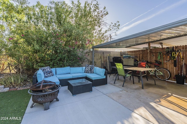 view of patio / terrace featuring an outdoor living space with a fire pit