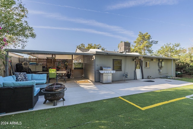 back of property with an outdoor living space with a fire pit, a yard, a patio, fence, and a chimney