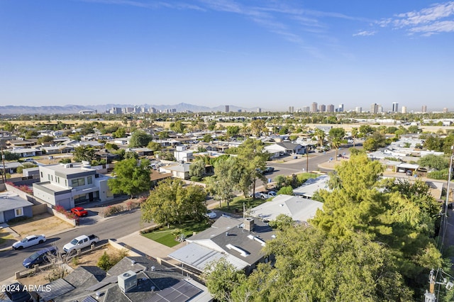 birds eye view of property featuring a mountain view