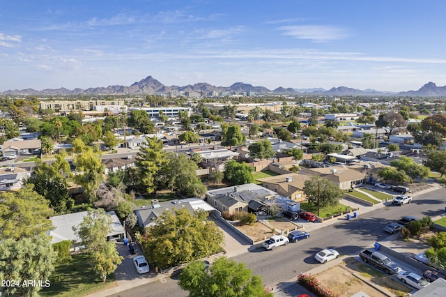 birds eye view of property with a mountain view and a residential view