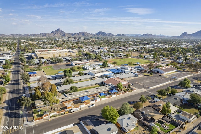 birds eye view of property with a mountain view