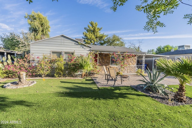 ranch-style house featuring a carport, driveway, fence, and a front lawn