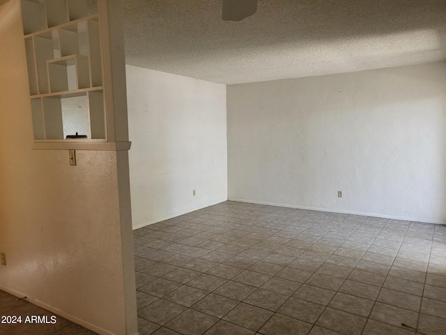 empty room featuring a textured ceiling