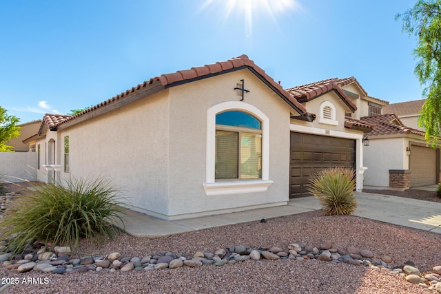 mediterranean / spanish-style home featuring a garage