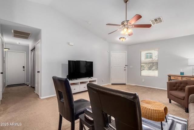 living room featuring ceiling fan, high vaulted ceiling, and light carpet