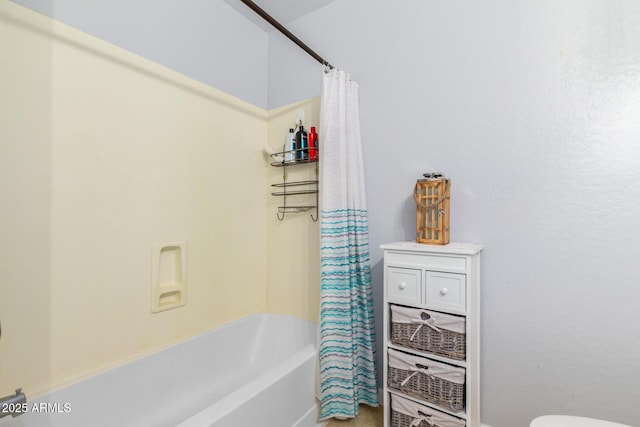 bathroom with shower / bath combo with shower curtain