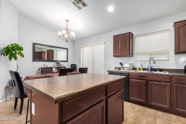 kitchen featuring dishwasher, a kitchen island, an inviting chandelier, sink, and hanging light fixtures