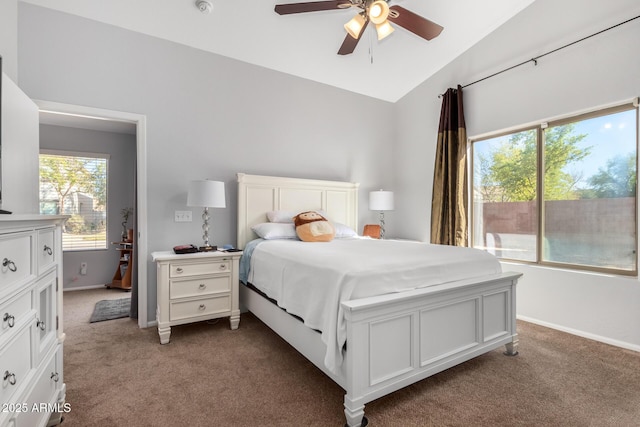 carpeted bedroom featuring ceiling fan, lofted ceiling, and access to exterior