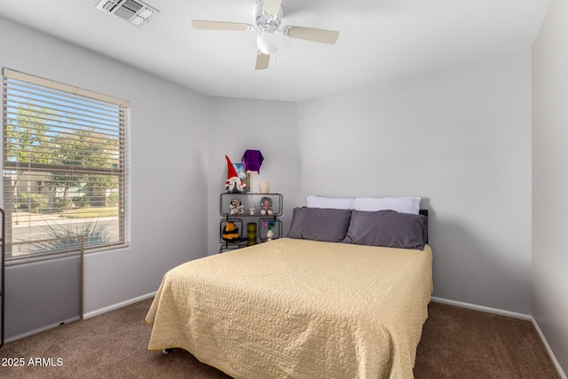 bedroom featuring dark colored carpet and ceiling fan