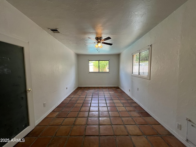 1618 W Vernon Ave, Phoenix, AZ 85007 - tiled empty room featuring a ceiling fan and a textured ceiling