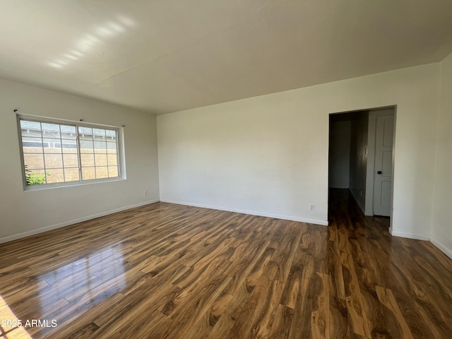 1618 W Vernon Ave, Phoenix, AZ 85007 - empty room with dark wood-style flooring and baseboards