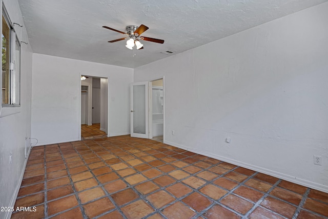 1618 W Vernon Ave, Phoenix, AZ 85007 - empty room with ceiling fan, baseboards, and a textured ceiling