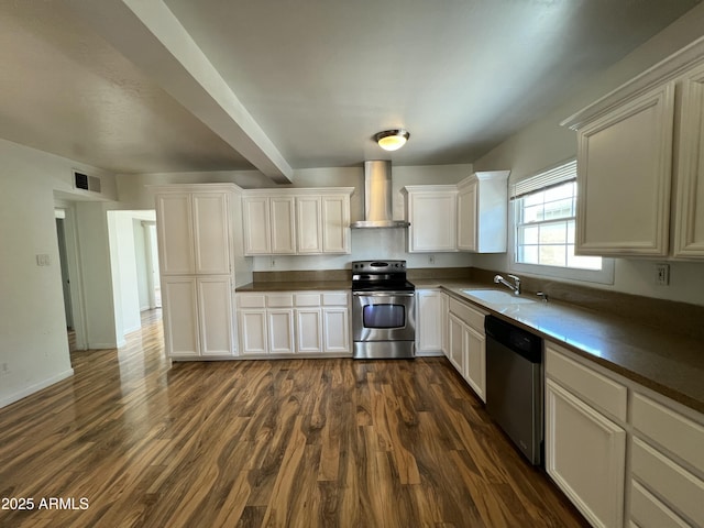 1618 W Vernon Ave, Phoenix, AZ 85007 - kitchen with stainless steel appliances, wall chimney range hood, a sink, dark wood-style flooring, and white cabinetry