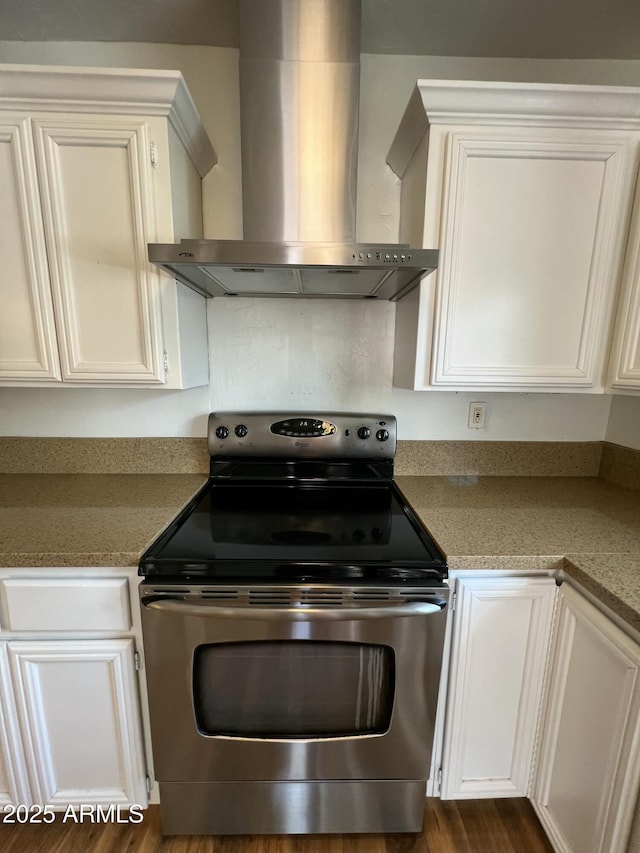 1618 W Vernon Ave, Phoenix, AZ 85007 - kitchen featuring wall chimney exhaust hood, stainless steel range with electric cooktop, white cabinetry, and light countertops