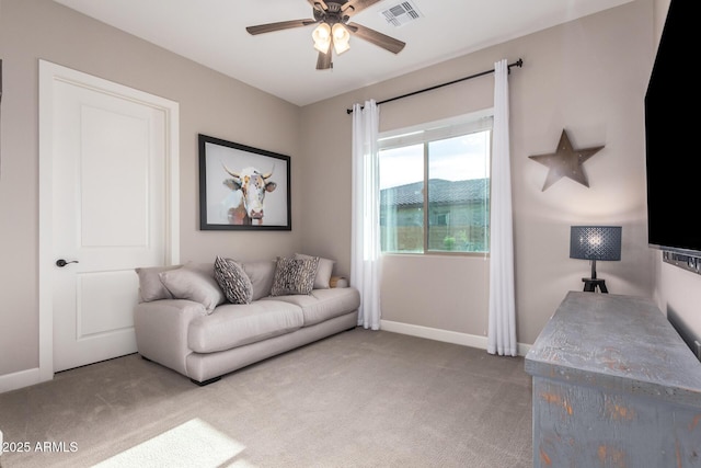 interior space featuring visible vents, baseboards, and a ceiling fan