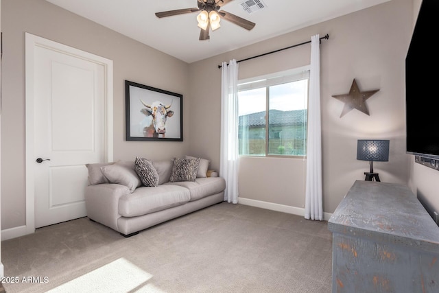 carpeted living room featuring ceiling fan, baseboards, and visible vents