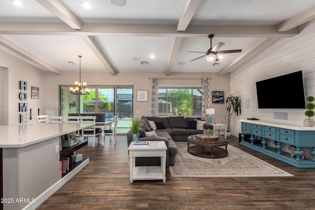 living room with visible vents, ceiling fan with notable chandelier, dark wood-style flooring, and beam ceiling