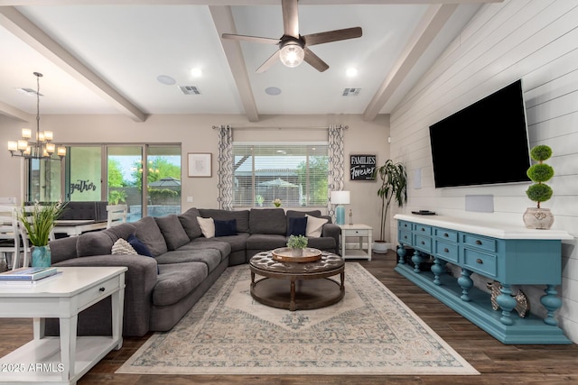 living area with dark wood-style flooring, visible vents, beam ceiling, and ceiling fan with notable chandelier
