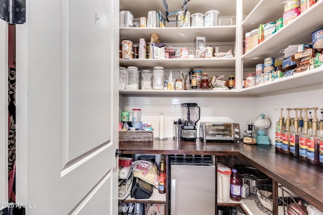 storage area featuring a toaster