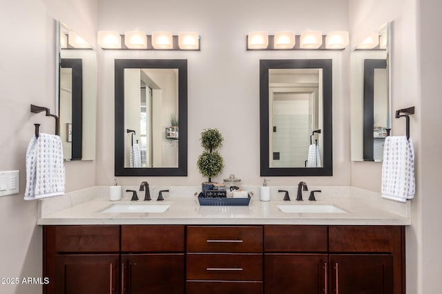bathroom with a sink and double vanity