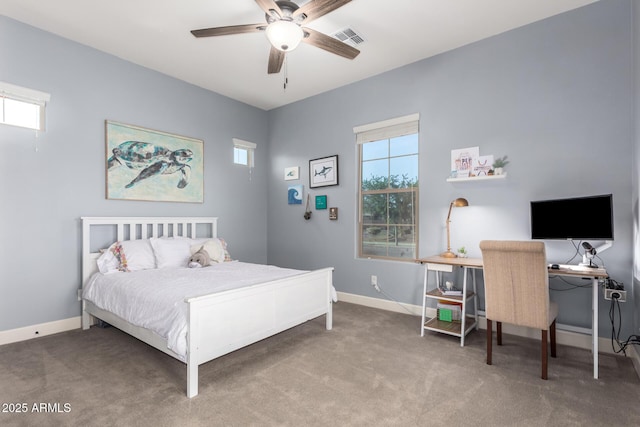 carpeted bedroom featuring baseboards, a ceiling fan, and visible vents