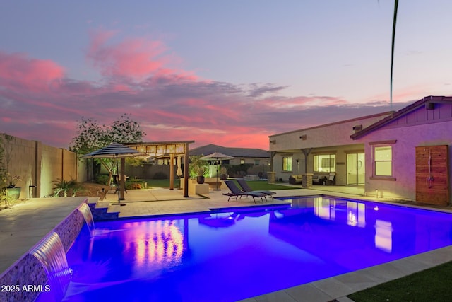 outdoor pool with a patio, a fenced backyard, and an outdoor hangout area