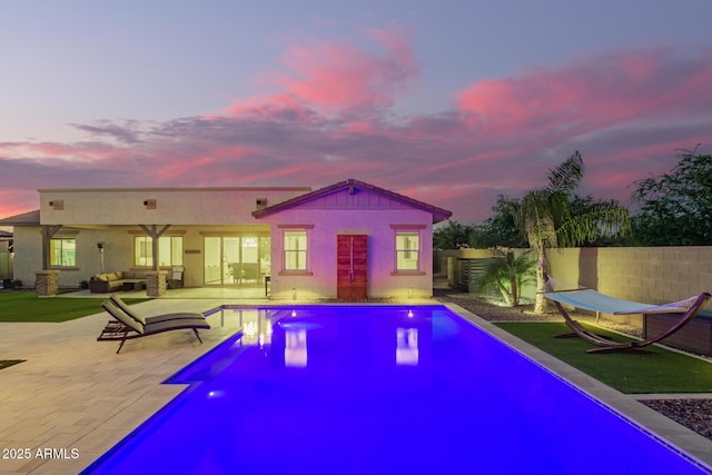 view of swimming pool featuring a patio area, a fenced backyard, an outdoor living space, and a fenced in pool