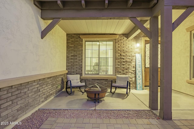 view of patio / terrace with a fire pit