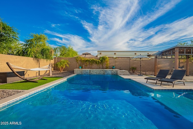 view of swimming pool with a fenced backyard, a fenced in pool, and a patio area