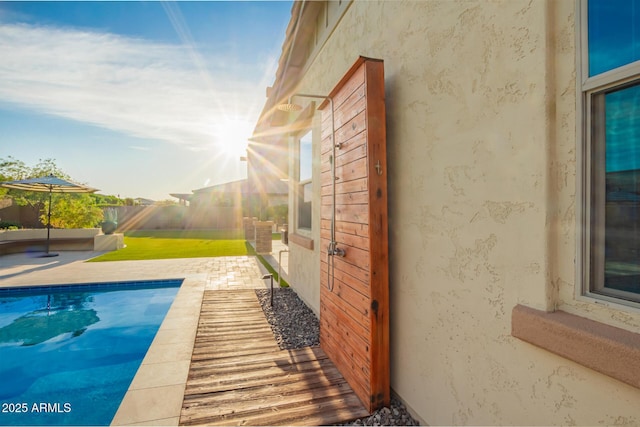 view of swimming pool with a fenced in pool, a patio area, and fence